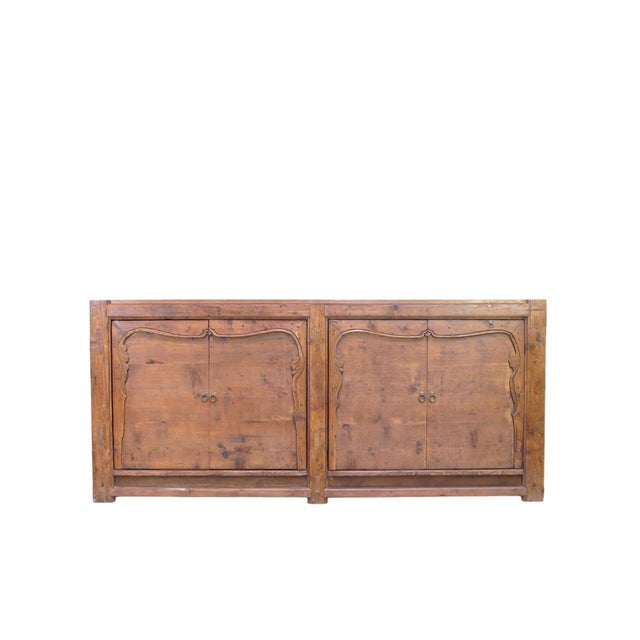 This 17th-century sideboard, originating from Shanxi Province, China, has been restored by local craftsmen to preserve its...