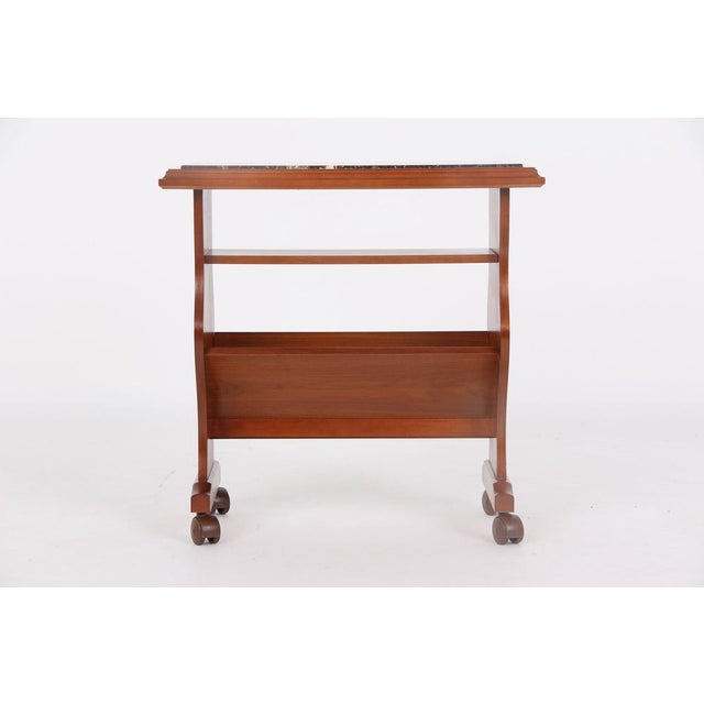 Beautiful retro-vintage newspaper table with magazine rack, medium brown wood (likely cherry) and Rosso Lavanto granite...