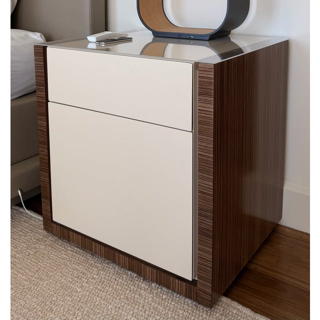 Pair of custom-designed nightstands featuring a refined combination of high-gloss lacquer drawer fronts and richly grained...