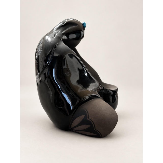 A striking blackware ceramic Mother and Child sculpture by New Mexico artist Lawrence Vargas, signed and dated 1994. Its...