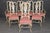 Elevate your dining experience with this exquisite set of eight 1960s era Italian style dining chairs, featuring six side...