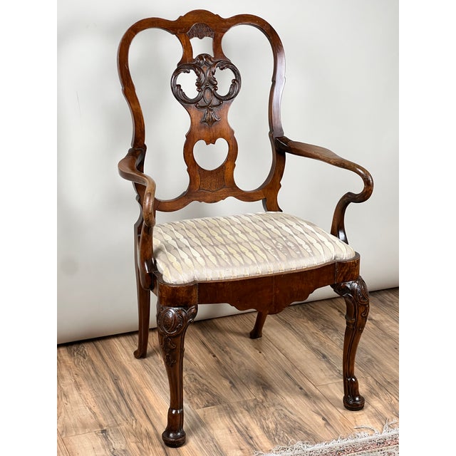 This elegant late 18th century George III open arm chair showcases the refined craftsmanship and graceful design...