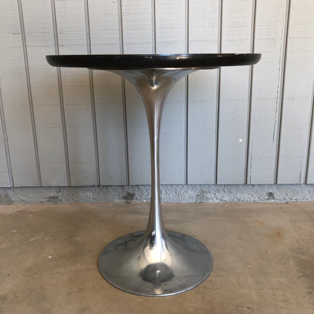 Tulip side table, I believe by Burke in the style of Saarinen. Aluminum base with laminate top. Age appropriate wear to...