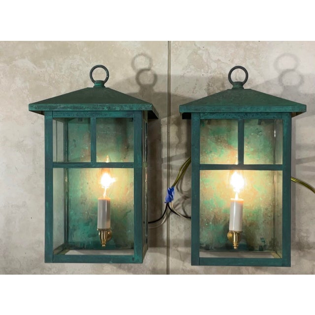 Elegant pair of handcrafted solid brass wall lanterns, these fixtures offer a perfect blend of charm and rugged...