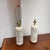 Design Plus Gallery presents a Pair of Chinoiserie Style Pierced Ceramic Table Lamps. Each lamp has a cylindrical cream...