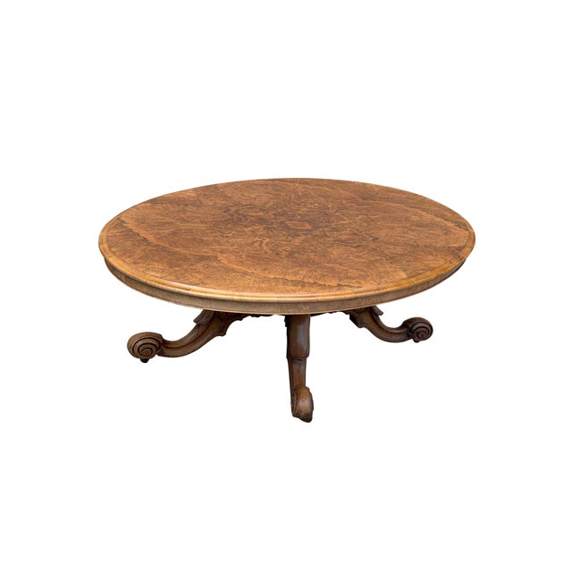 This exquisite circular center table features a stunning book-matched walnut burl wood top, showcasing a symmetrical,...