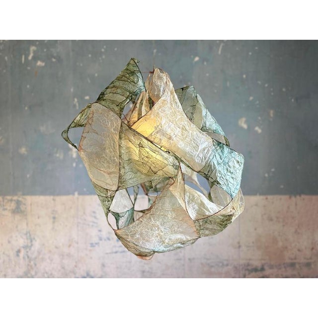Multi léonard pendant lamp in bio material with natural dyes by thibault philip. One of a kind. Dimensions: w 80 x d 75 x...