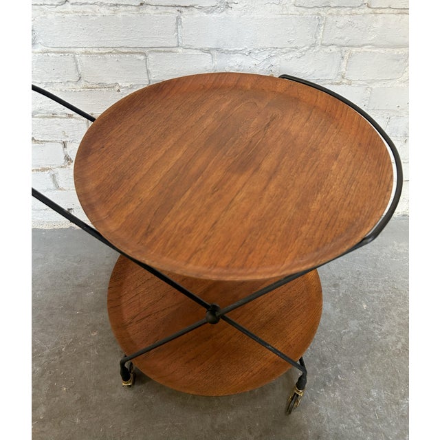 Bar cart designed by Paul Nagel for JIE Gantofta in Sweden in the 1950s-60s. Folding metal structure on which two teak...