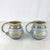 Incredible pair of handmade vintage studio pottery mugs. Twisted handles. Beautiful drippy glaze of green, blue, grey and...