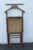This Mid Century classic Butler or Gentleman's Valet is made of wood, rushing/caning, and is in good condition. This...