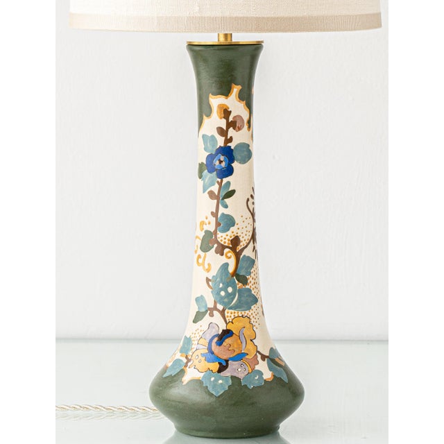 Blending art nouveau organicism with the emerging simplicity of art deco, this rare table lamp is crafted from an antique...