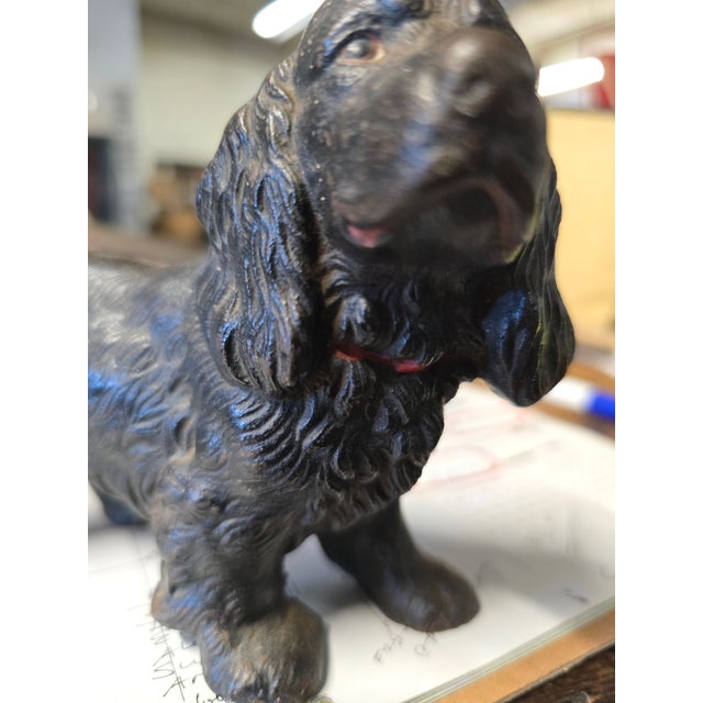 Great little cast iron dog. probably by Hubley. early 1900's. black painted body with red collar. red at lips. painted eyes.