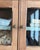 A warbler suspended between a cabinet of curiosities and an antique apothecary cabinet. This small oak wall-mounted...