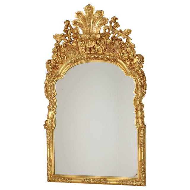 An impressive, large, classic mirror in Rococo or Baroque style, featuring Chinoiserie influences along the sides in the...