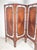 A Danish four-panel folding screen / room divider in teak, circa 1960s. The teak on one side features a radiating...