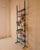 Floor-to-ceiling bookcase made in Italy in the 1960s. The bookcase consists of seven wooden shelves secured with screws to...