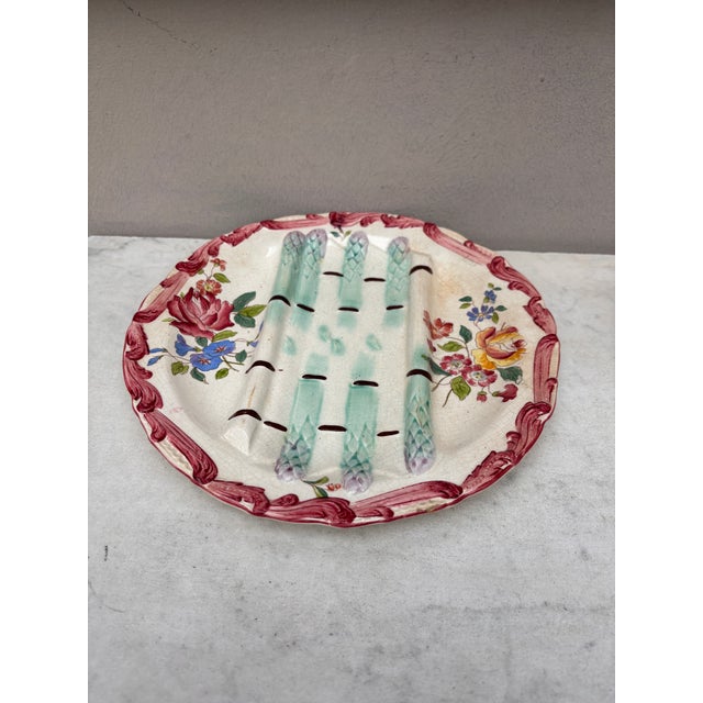 Majolica asparagus plate with flowers , signed Longchamp circa 1890.