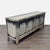 Inspired by European antiques, a distressed black finish and copper-clad hardware are featured in this pine media console....
