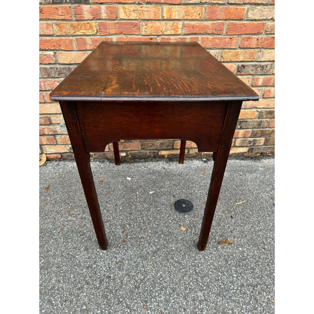 This is a beautiful mid 19th century, English side table. The tops shows an amazing amount of patina and age. The drawer...