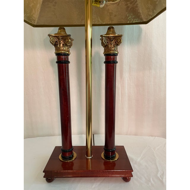 Neoclassical Double Column Table Lamp with wood columns and brass Corinthian pediments on a wood base. Hard Black shade...