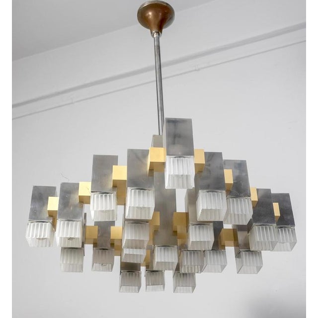 Famous chandelier belonging to the series inspired by a trip of gaetano sciolari in new york, the chandelier is composed...