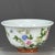 This is a charming vintage porcelain teacup, decorated in the famille rose palette with vibrant polychrome enamels. The...