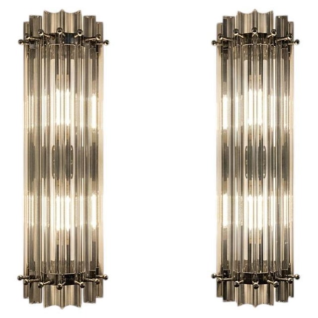 Four vintage Murano wall sconce made by 7 Murano crystal prism (triedri) for each applique in a chrome metal frame. The...
