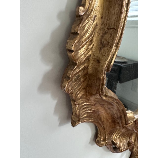 Mid-Century Rococo style giltwood mirror made in Italy.