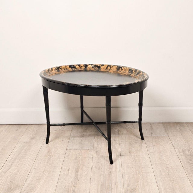 An English lacquered & gilt papier-mâché tray, circa 1870, on later custom stand.