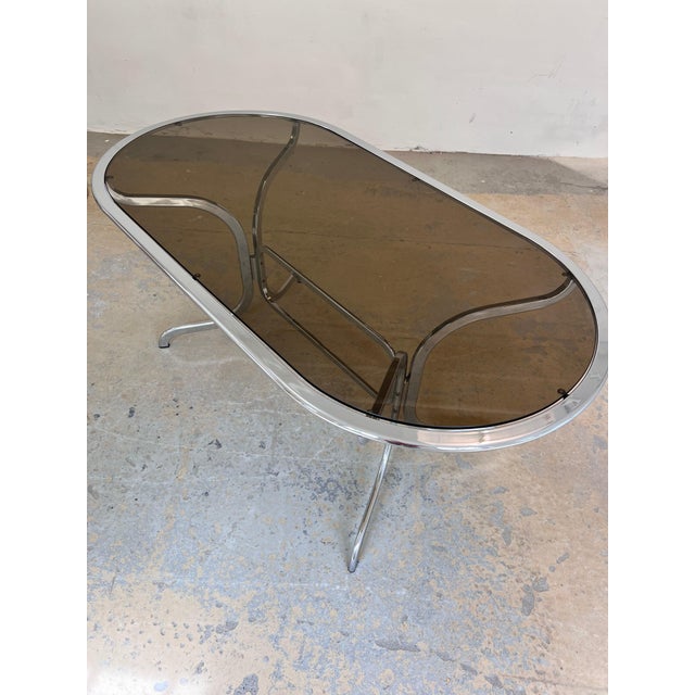 This oval dining table by Gastone Rinaldi for Rima is a true masterpiece of 1970s space-age design, bringing the...