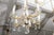 A graceful French Louis XV-style chandelier featuring an elegant combination of finely cast gilt bronze, hand-cut crystal,...
