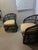 These barrel back rattan chairs represent a popular mid-century design style that flourished from the 1960s through the...