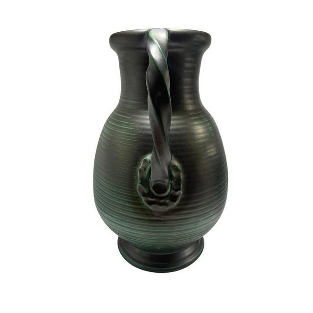 Vase made by Upsala Ekeby in the 1930's. An Upsala Ekeby vase is a piece of Swedish ceramic made by Upsala Ekeby, a well-...