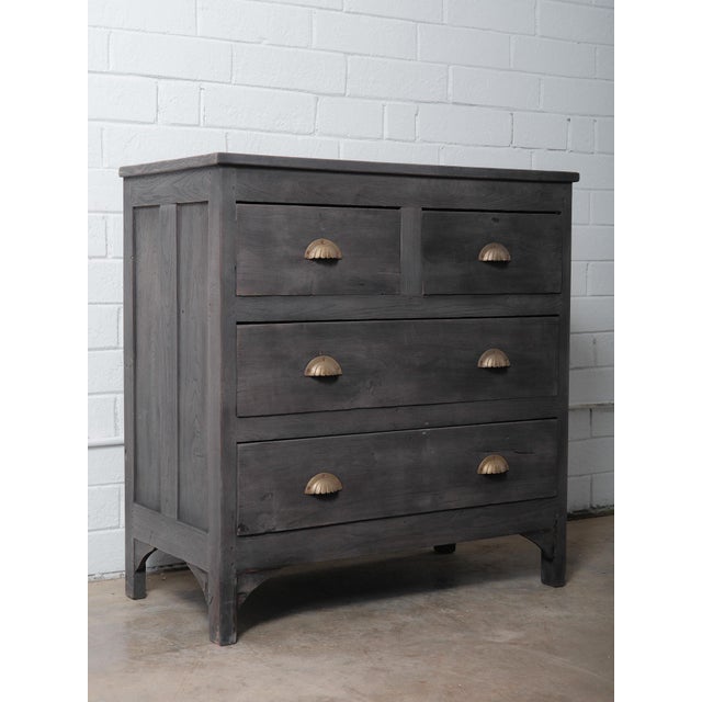 This vintage wooden chest features a handsome charcoal-toned finish and a classic, understated silhouette that blends...