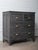 This vintage wooden chest features a handsome charcoal-toned finish and a classic, understated silhouette that blends...
