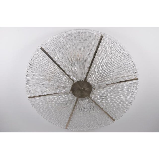 Large art deco flush mount from 1940s germany, composed of multiple sculptural glass panels arranged in a striking radial...