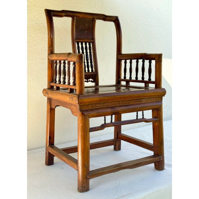 Lovely antique Chinese elm wood armchair, likely Ming, 19th century. 4 legs secured by 4 stretchers with dowel joinery,...