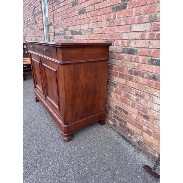 A beautiful 19th century French sideboard server. It features a useful storage which includes drawers and two cabinet...