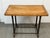 Design Plus Gallery presents a Bewick Industrial Table. The rectangular wood top displays natural grain variation, visible...