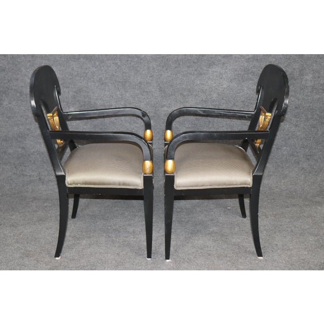 This exceptional set of four Regency-style armchairs embodies the bold sophistication and refined elegance that defined...
