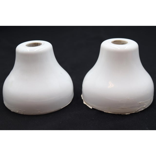Vintage bell shaped faucet covers made of ceramic with a white porcelain finish. Stamped M B Co. Good condition with...