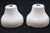 Vintage bell shaped faucet covers made of ceramic with a white porcelain finish. Stamped M B Co. Good condition with...