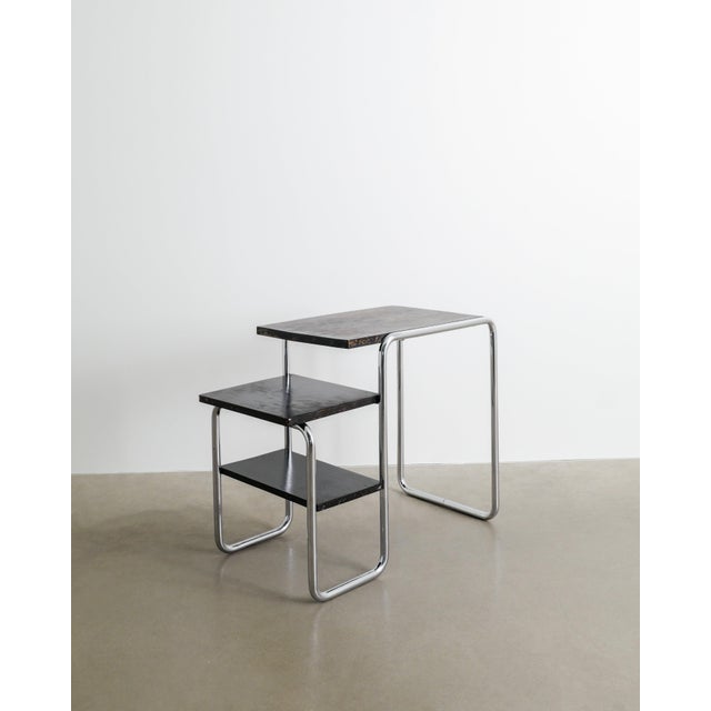 A rare and early mid-century bauhaus "b21" console desk table with a chromed tubular steel base and black stained wooden...
