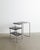 A rare and early mid-century bauhaus "b21" console desk table with a chromed tubular steel base and black stained wooden...