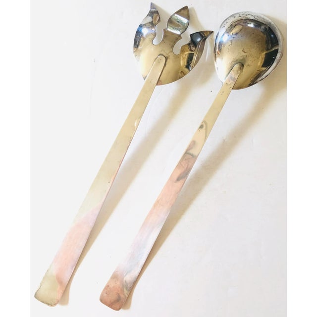 Elegant servers with clean lines work well in any setting. Silver plated pair with fork and spoon.