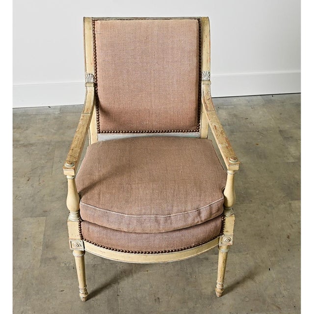 A majestic French 19th century Directoire fauteuil armchair in charming patinated finish that reveals at least three...