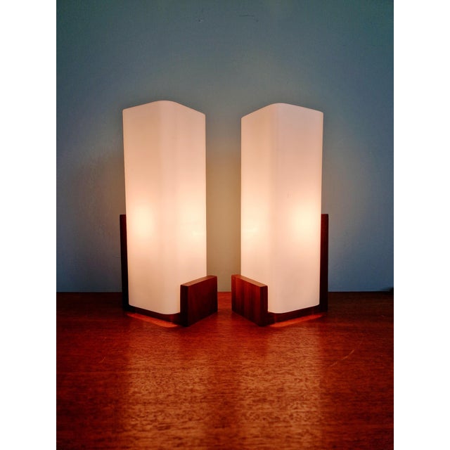 Pair of rectangular teak wall sconces with satin white opaline glass shades, designed by louis kalff, aurey model, for...