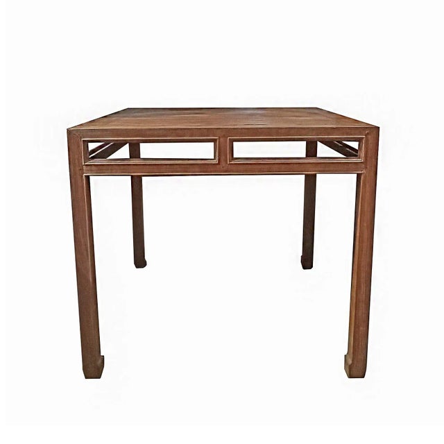 A high-top teak table, hand-crafted in Indonesia, mid-20th Century. Clean, straight lines that combine with the...