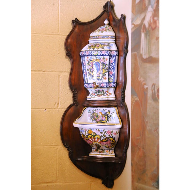 Decorate a wall with this elegant ceramic fountain on board from the south of France. Crafted in Desvres circa 1920, the...