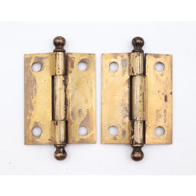 Vintage cabinet hinges made of brass plated steel with ball tips, three knuckles, and a template hole pattern. Made by...